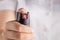 Woman holding pepper spray tear gas in his hand. Self defense. Blur background, close up