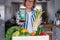 Woman holding a phone with active online mobile app of Healthy diet program and fresh asparagus bunch. New Start of