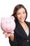 Woman holding piggy bank