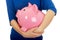 Woman holding piggybank.