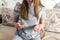 Woman holding pill and glass of water in hands taking emergency medicine, supplements painkiller medication.