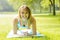 Woman holding plank pose outside