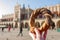 Woman holding pretzel - traditional Polish snack on Market Square in Cracow