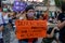 Woman holding a protest poster on International march for women\'s day