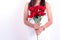 Woman holding red rose flower. Valentines day and  Couples concept. Love and Flirting theme. Close up at rose. Body part and
