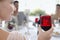 Woman Holding Red Wineglass At Party