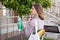 Woman holding Reusable bottle and eco bag with groceries. Ecological shopping and zero waste lifestyle concept