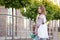 Woman holding Reusable bottle and eco bag with groceries. Ecological shopping and zero waste lifestyle concept