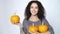 Woman holding ripe orange pumpkins