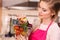 Woman holding shopping backet with vegetables