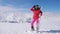 Woman Holding Skis, Wearing A Goggles, Standing Background Snow-Capped Mountains