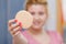 Woman holding small face sponge