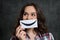 Woman Holding Smiley Emoticon