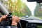 Woman holding steering wheel, drives the car