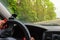 Woman holding steering wheel, drives the car