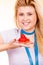 Woman holding strawberry sweet cupcake