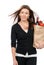 Woman holding a supermarket paper shopping bag