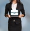 Woman is holding tablet with briefcase icon