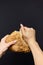 Woman holding tasty fresh bread, close up