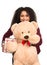 Woman is holding a teddy bear and a christmas gift