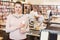 Woman holding thick book in bookstore