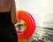 Woman holding a tube at the beach