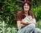 Woman holding two Siberian Husky Puppies