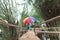 Woman holding an umbrella on the bridge.