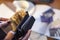 Woman holding wallet and money and some credit cards on the table