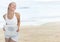 Woman holding weighing scale on the beach