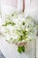 Woman holding white wedding bouquet