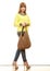 Woman holds brown fringe handbag