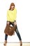 Woman holds brown fringe handbag