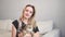 A woman holds a cat in her arms in a veterinary clinic