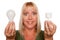 Woman Holds Energy Saving and Regular Light Bulbs