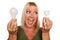 Woman Holds Energy Saving and Regular Light Bulbs