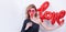 Woman holds love word shaped red balloon