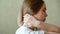 Woman holds neck with pain cervical muscle spasm by hand. Neck pain, cervical vertebrae, Disease of musculoskeletal system in