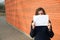 Woman holds a piece of paper near the face