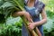 Woman holds rhubarb