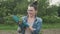 Woman holds seedling of cabbage in her hands in vegetable garden. Spring gardening, hobby, farming concept