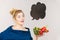 Woman holds shopping basket with vegetables, speech bubble