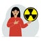 A woman holds a sign with a warning about nuclear danger. The concept of nuclear war, radiation, biohazard.