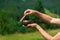 A woman holds a singing bowl in her hands. Selective focus.