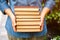 Woman holds stack books in her hands