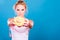 Woman holds sweet bun recommending non sugar diet