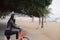 Woman On Holiday Ride on a bicycle On Winter Beach