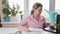 woman at home counting utility bills on a calculator, Professional woman working at her desk in a modern office