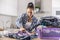 Woman at home focuses her attention to detailed ironing of clothes in the house