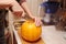 A woman at home is going to cook some pumpkin porridge
